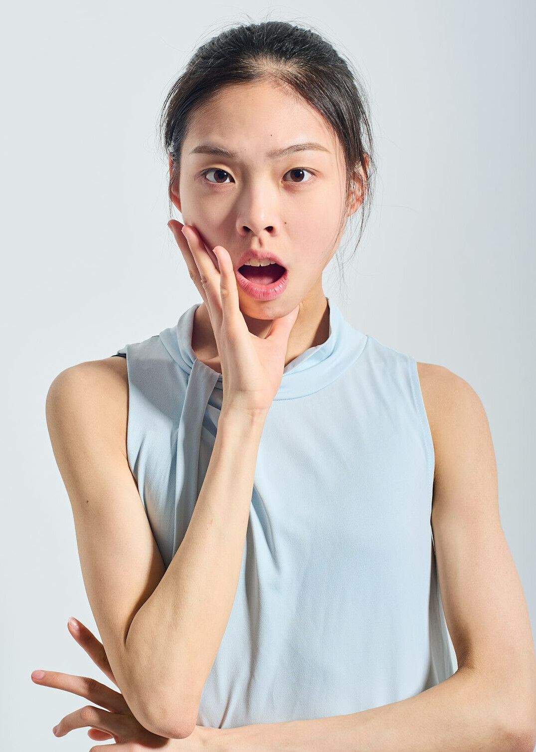Studio portrait of an East Asian business communication expert woman