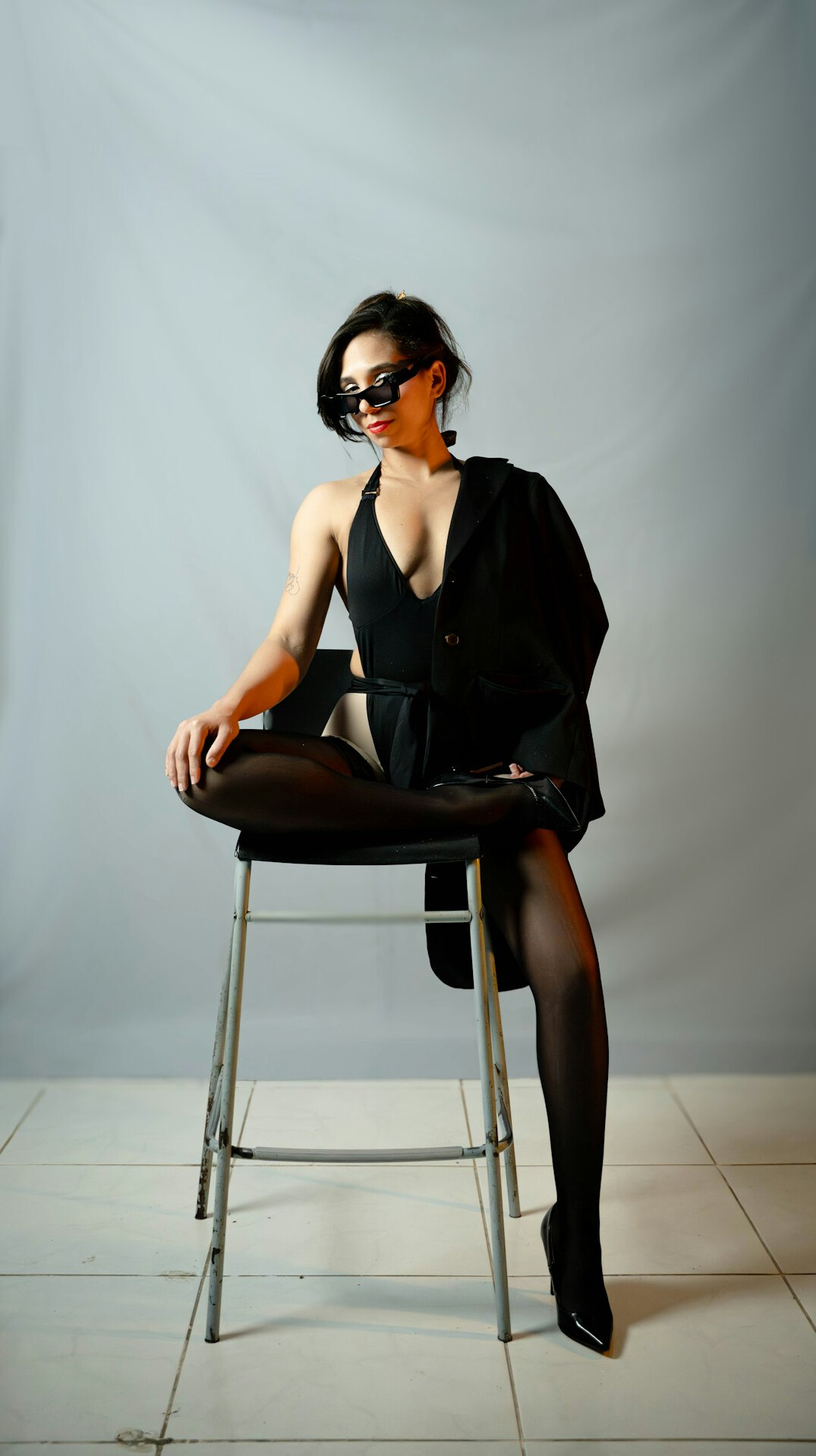 Studio portrait of a senior European academy director woman with glasses
