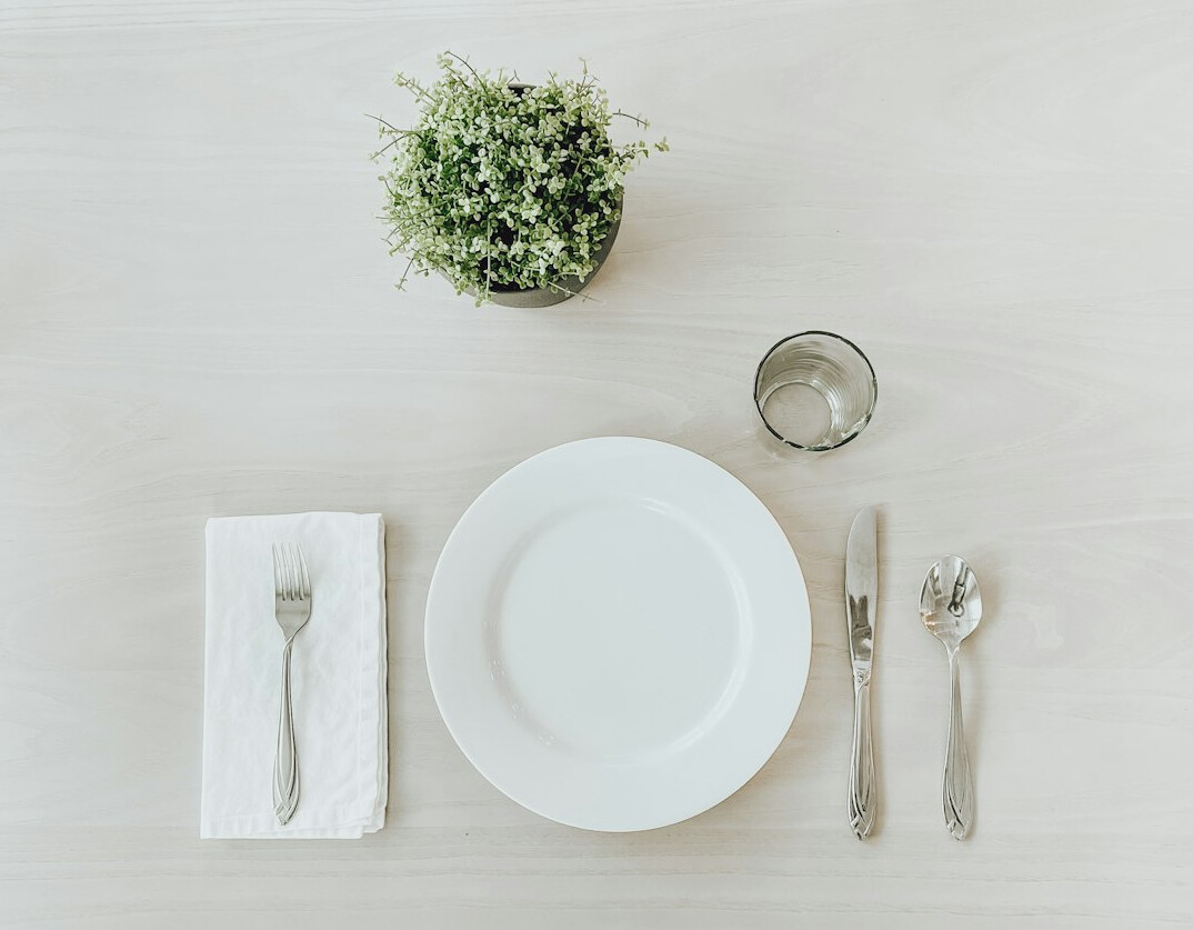 Formal dinner table setting with elegant tableware for an etiquette workshop
