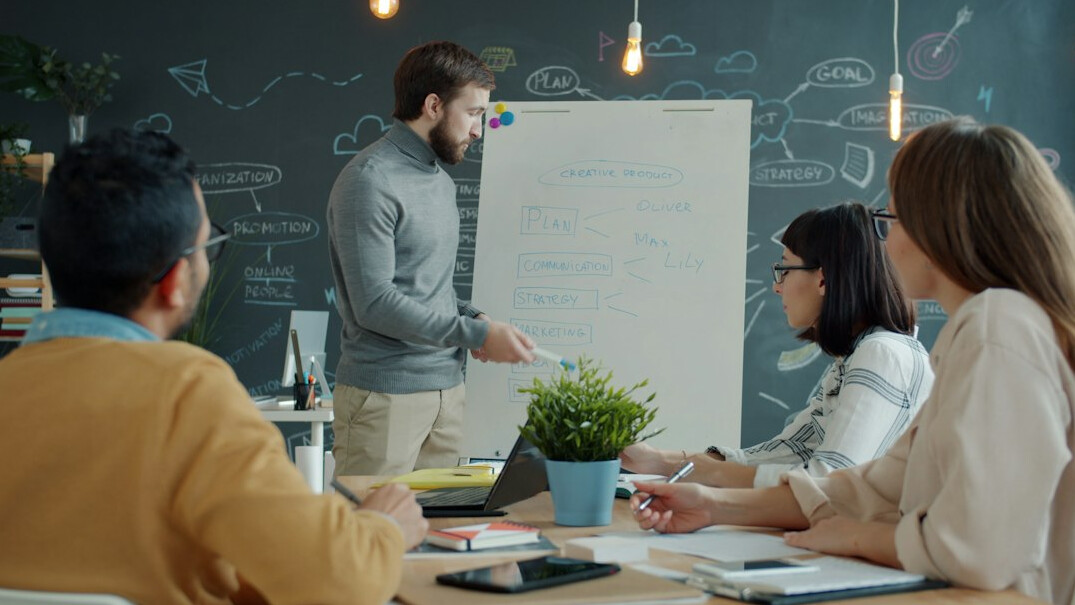Corporate team in a modern boardroom during a customized training session